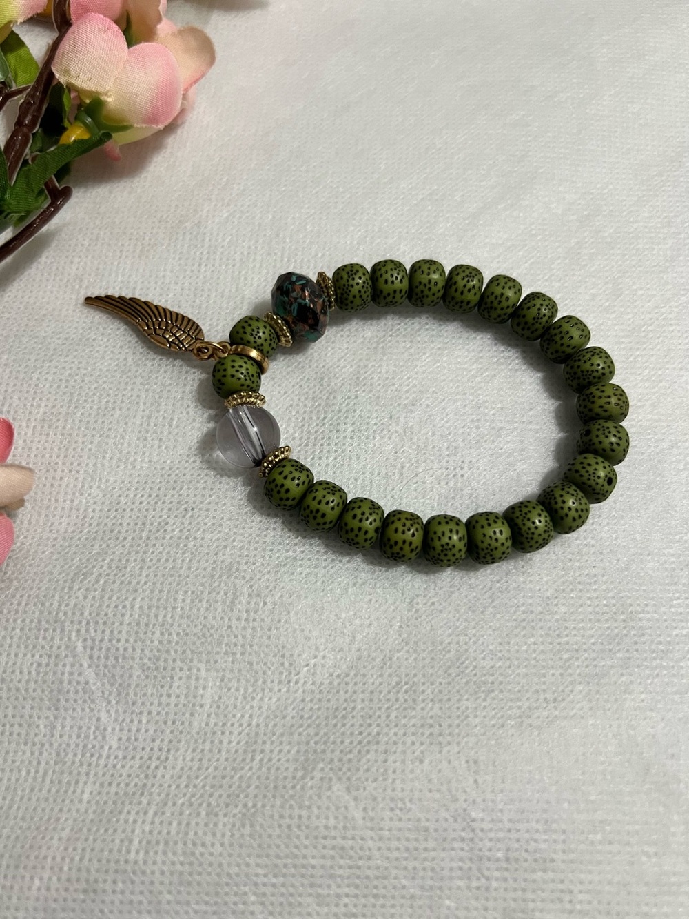 Green Beaded Stretch Bracelet with Wing Charm